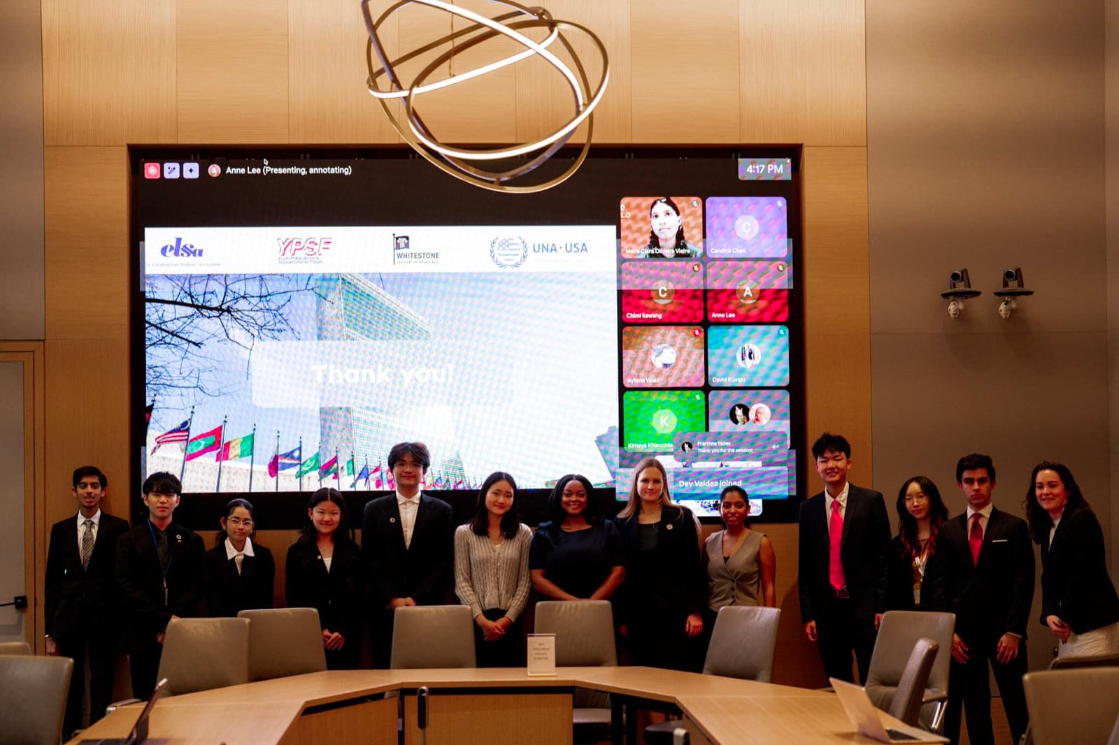 Whitestone cohort gathered in front of a partner event display