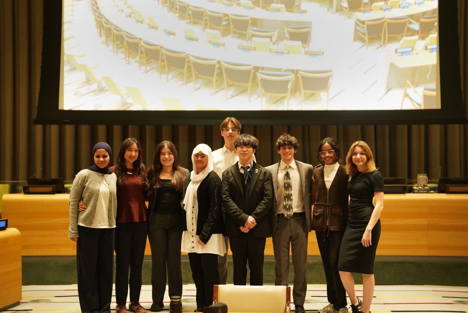 The Whitestone team photographed inside a United Nations chamber